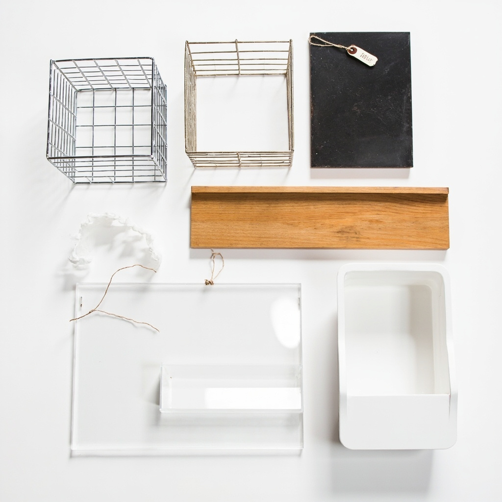 Shelf organizer material samples laid flat: wire, bamboo, metal, acrylic, and plastic